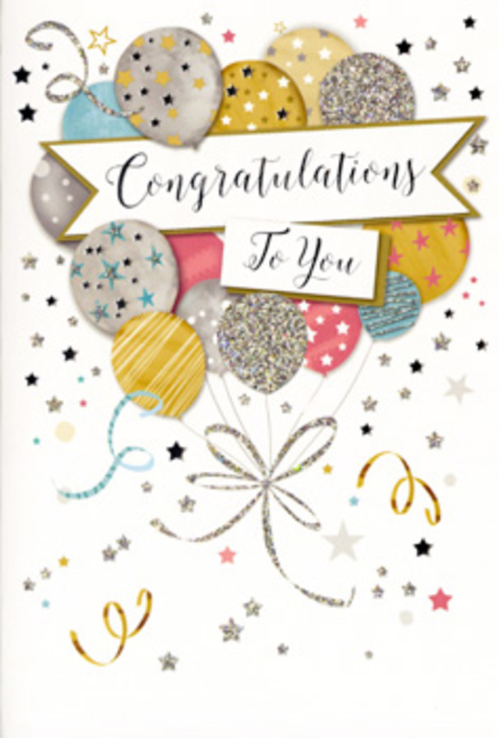 The image shows a sophisticated yet playful congratulations card, photographed closed so that the entire design of the front cover is visible. The composition centres on a lively bouquet of illustrated balloons, carefully balanced in the middle of the card much like a florist's focal arrangement. Rounded balloons in metallic gold, brushed silver and champagne hues blend with softer shades of baby blue, blush pink and gentle grey, overlapping in a layered cluster that feels full but never crowded. Each balloon is adorned with delicate accents-sparkling dots that resemble glitter, tiny scattered stars and slender stripes-creating subtle variations in texture and capturing the sense of festivities starting in the quiet streets around Motspur Park. From each balloon, slim, curling strings fall in graceful gold and silver lines, looping and intertwining as they descend to a loose gathering near the bottom of the design, echoing the way ribbon strands might pool beneath a freshly tied bouquet. A crisp white banner arcs neatly across the centre, clearly displaying the message "Congratulations To You" in elegant, scrolling calligraphy that adds a formal yet friendly touch. Around the central cluster, small metallic stars, dots and curly ribbon motifs are scattered over a pale, almost creamy background, suggesting confetti drifting gently through the air at the height of a celebration. The palette is soft and luminous rather than loud, giving the card a timeless, versatile feel-equally suited to honouring exam results at a local school, a new job in the city, or a personal achievement celebrated at home near Motspur Park station. Paired with fresh seasonal flowers delivered across Motspur Park and nearby Old Malden, this card completes the story of shared pride and heartfelt congratulations.